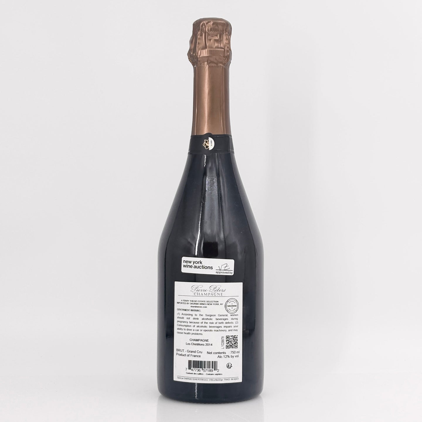 Bottle of champagne with a visible label on a white background