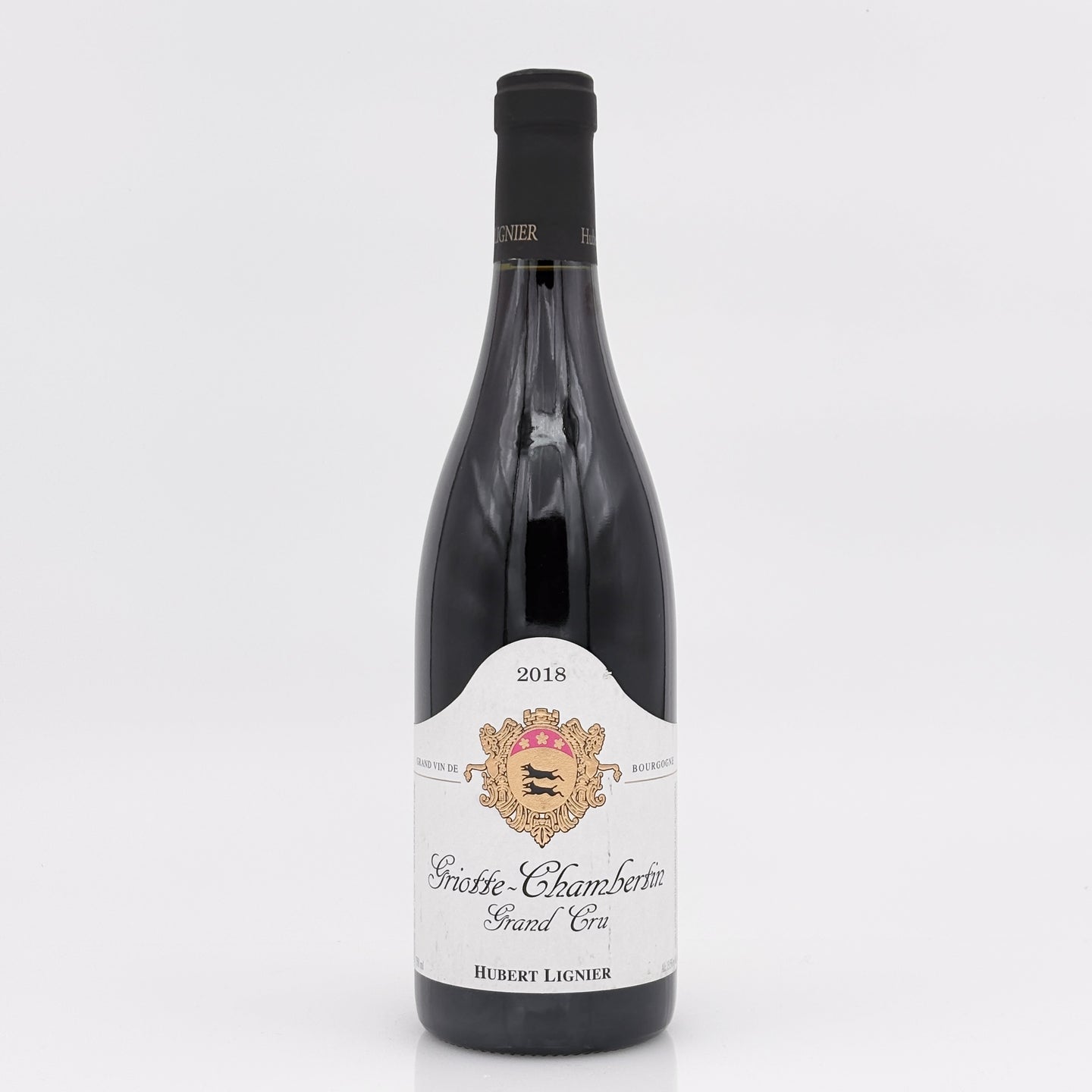 Wine bottle with a white label on a light gray background