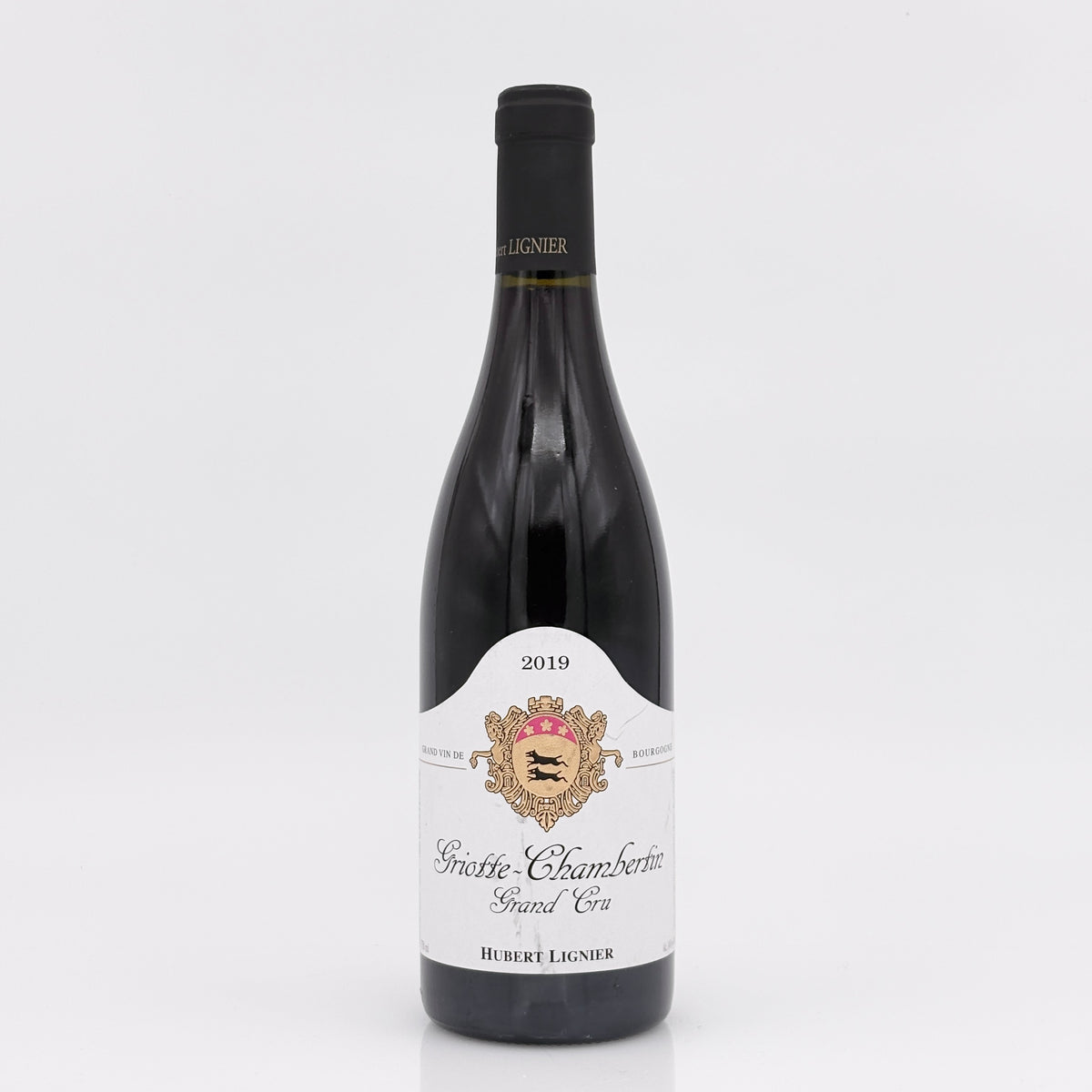 Wine bottle with a white label on a light gray background