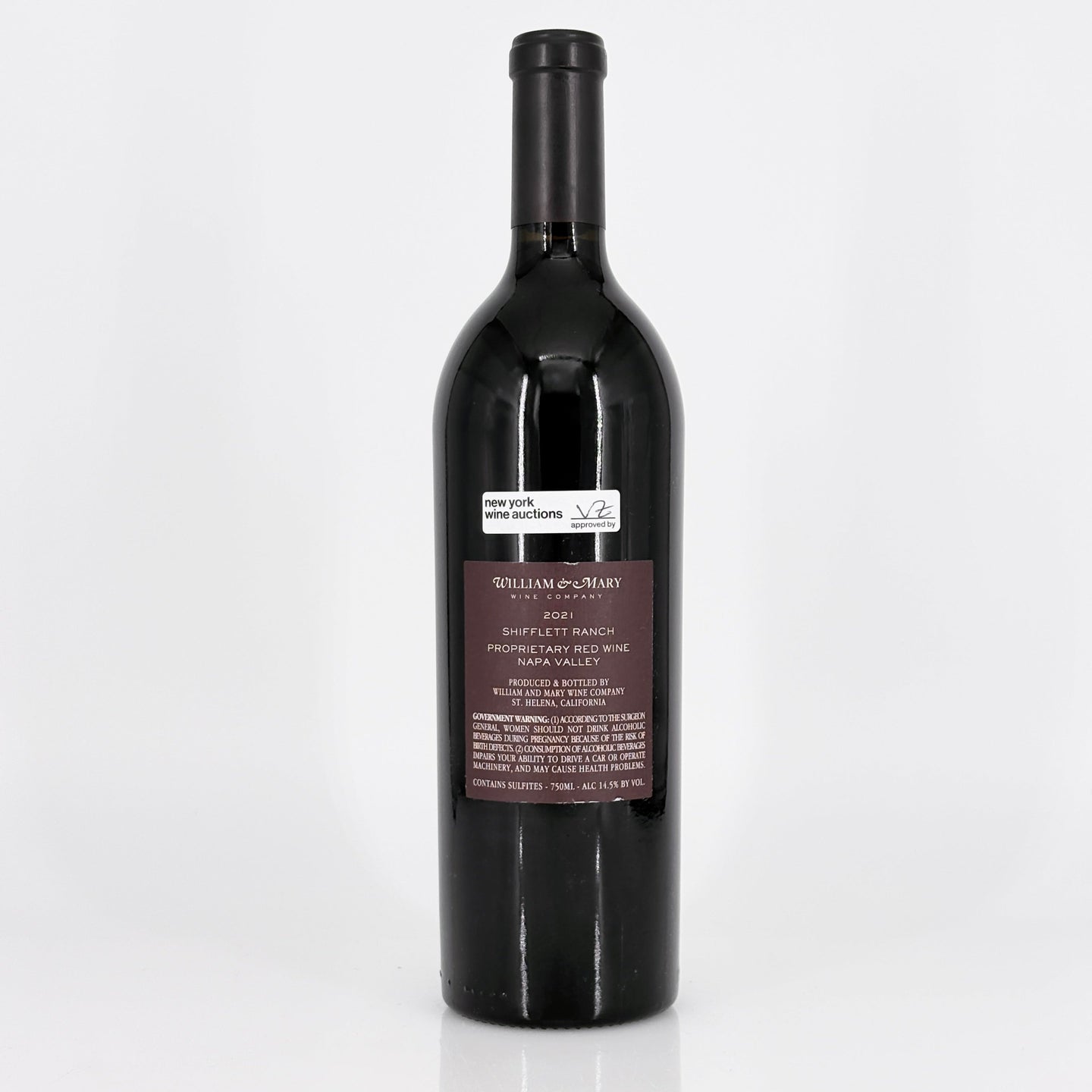 Red wine bottle with a label on a white background