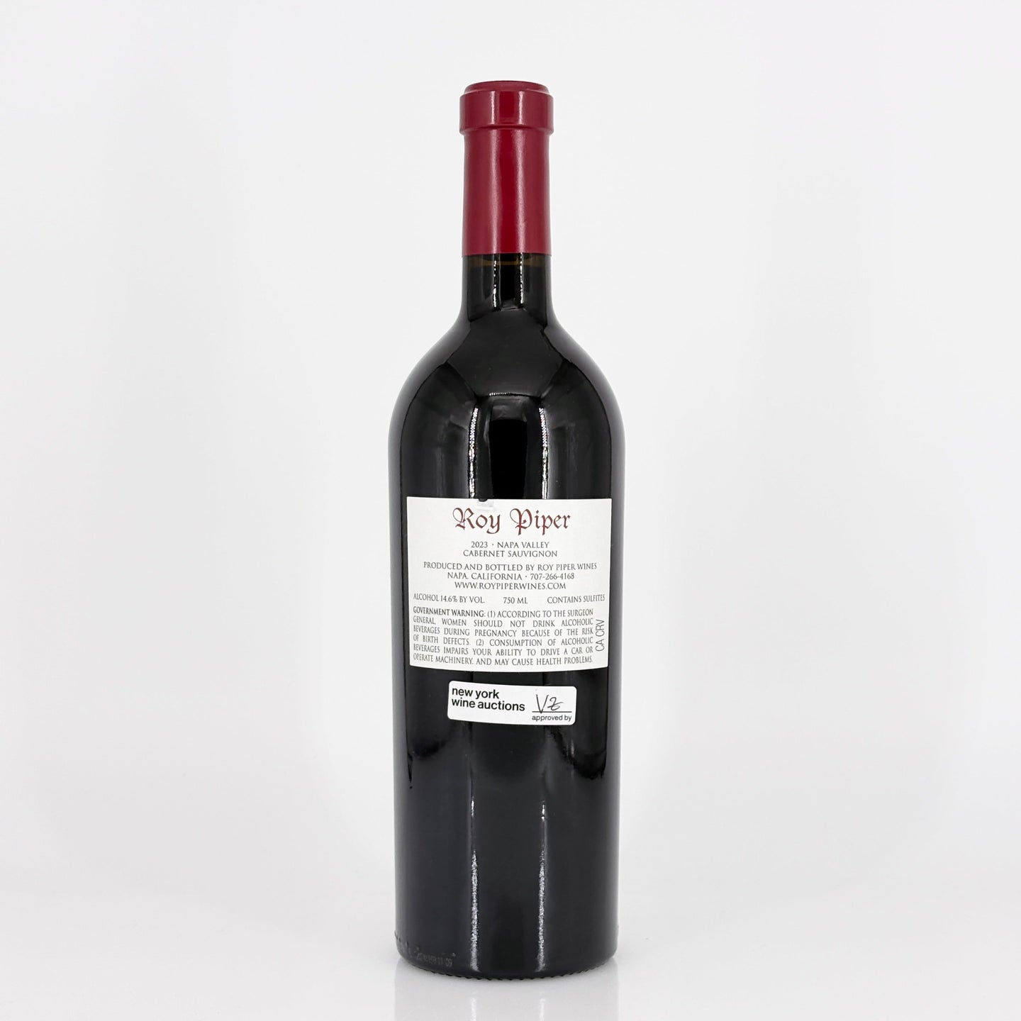 Red wine bottle with a visible label on a white background
