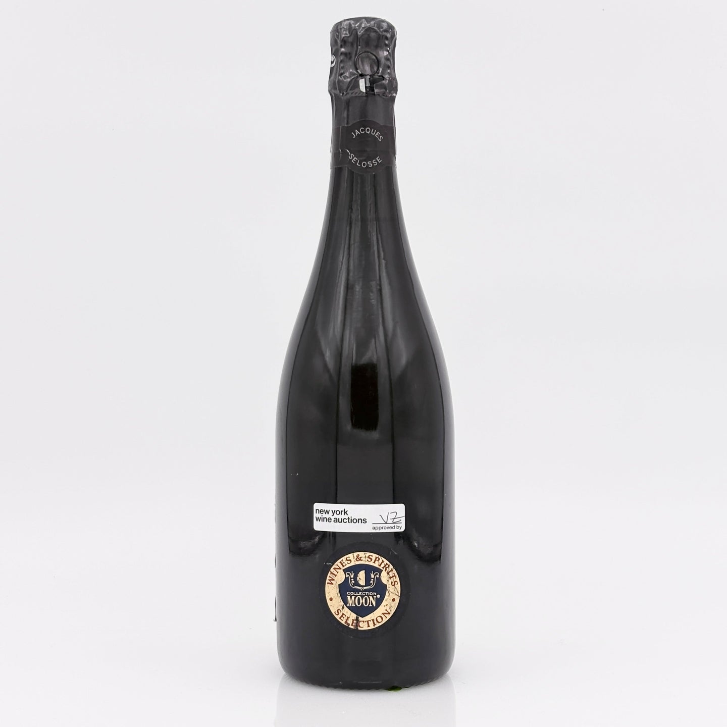 Black bottle with a label on a white background