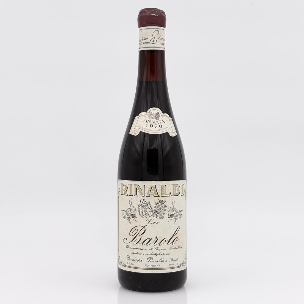Red wine bottle with white label on a white background