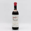 Barolo wine bottle with a white label on a light gray background