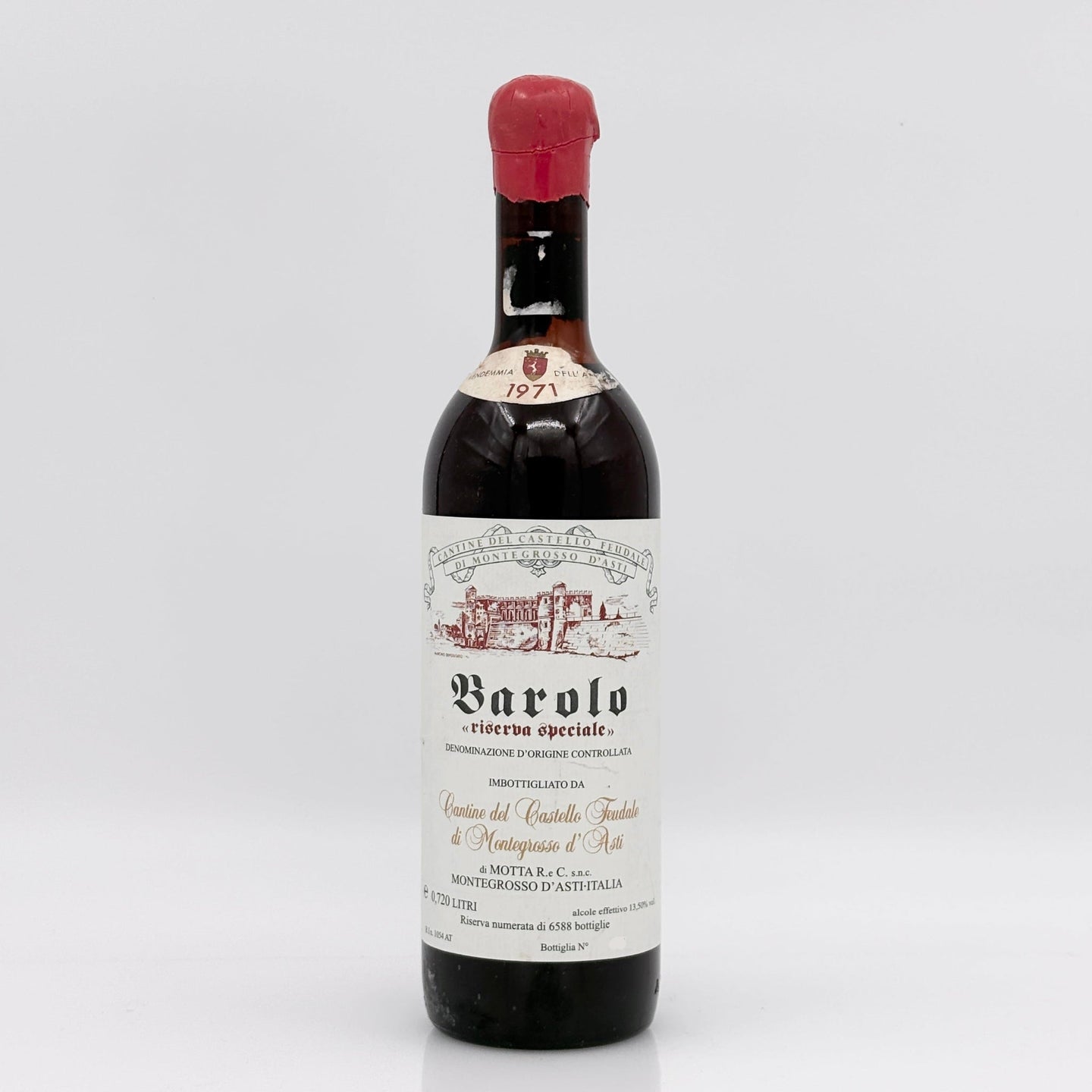 Barolo wine bottle with a white label on a light gray background