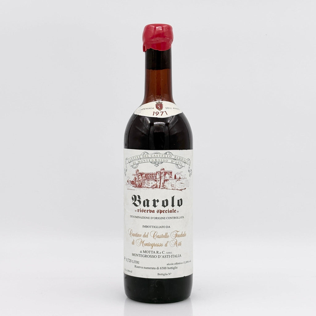 Vintage Barolo wine bottle with a white label on a light gray background