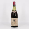 Vintage wine bottle labeled 'clos de tart' on a white background