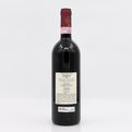 Red wine bottle with a visible label on a white background
