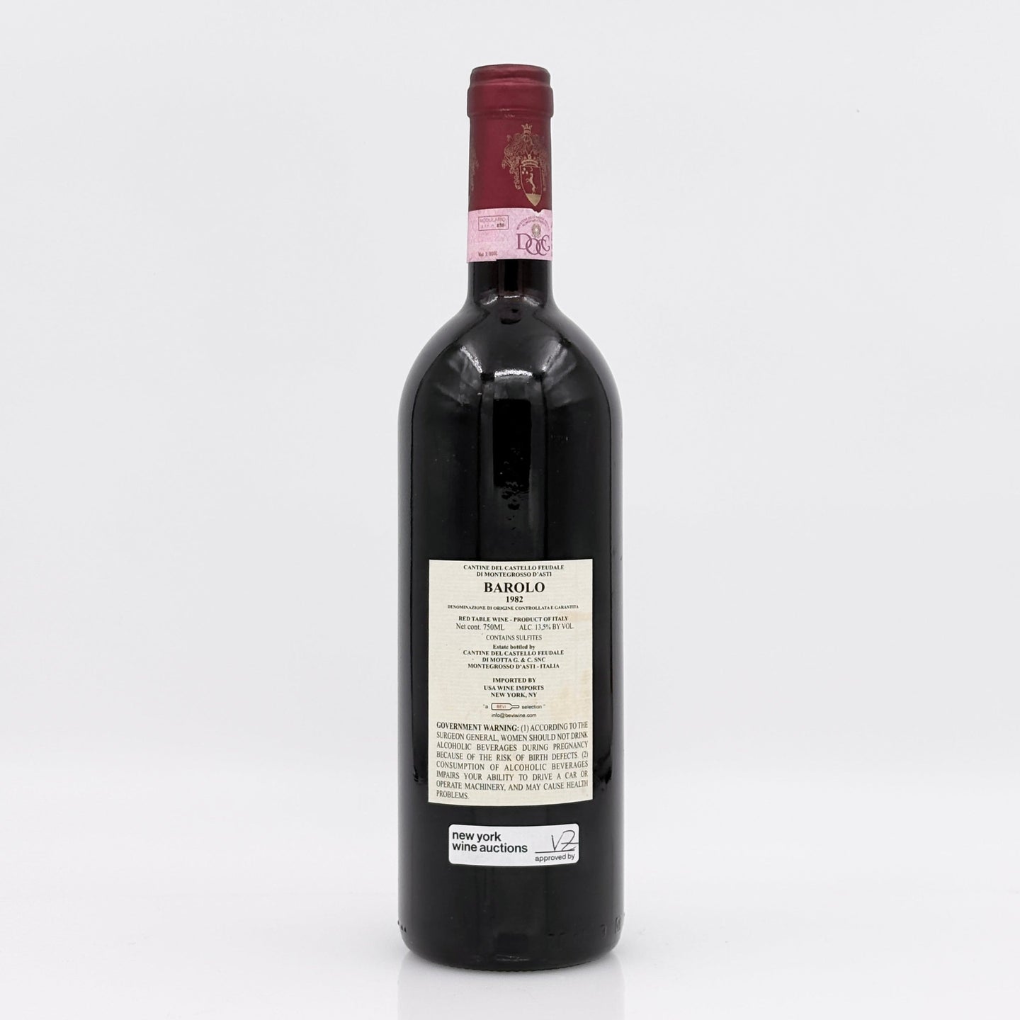 Red wine bottle with a visible label on a white background