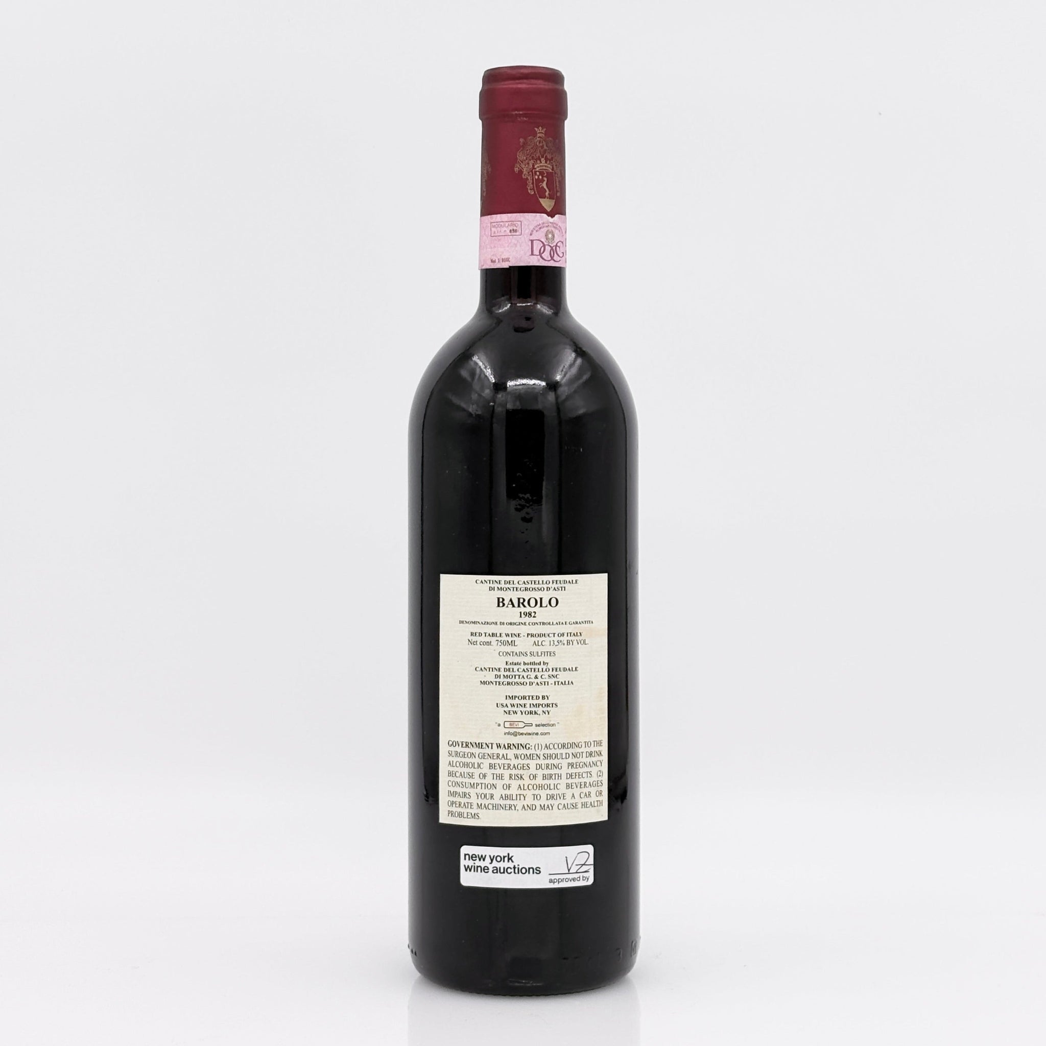 Red wine bottle with a visible label on a white background