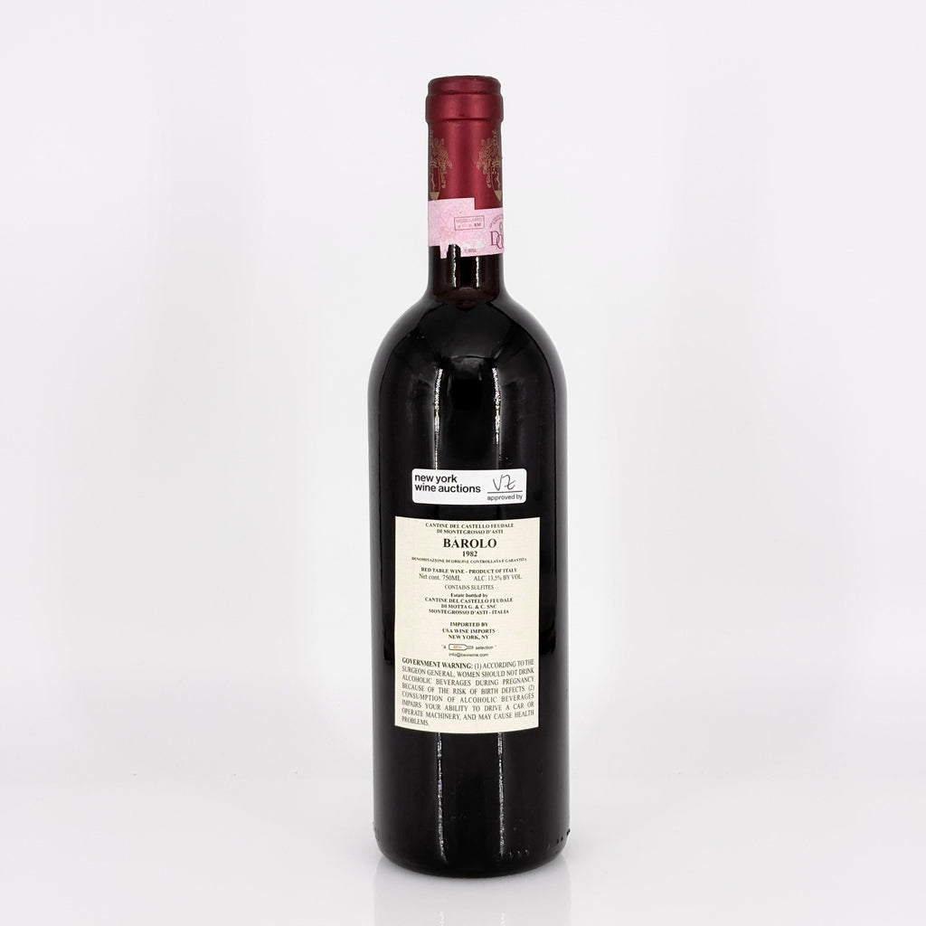 Red wine bottle with a visible label on a white background