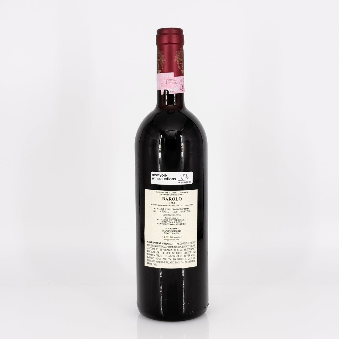 Red wine bottle with a visible label on a white background