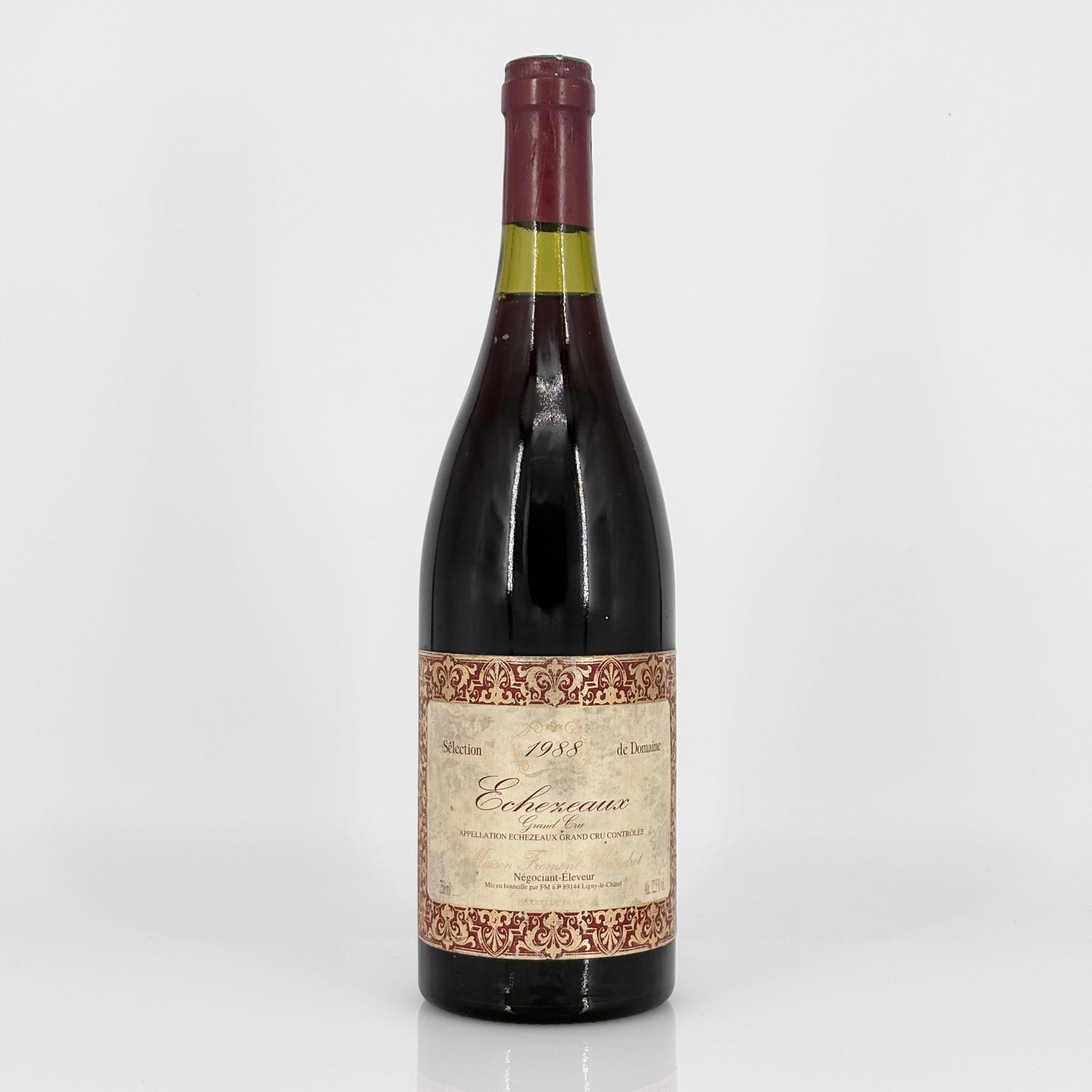 Wine bottle with decorative label on a white background