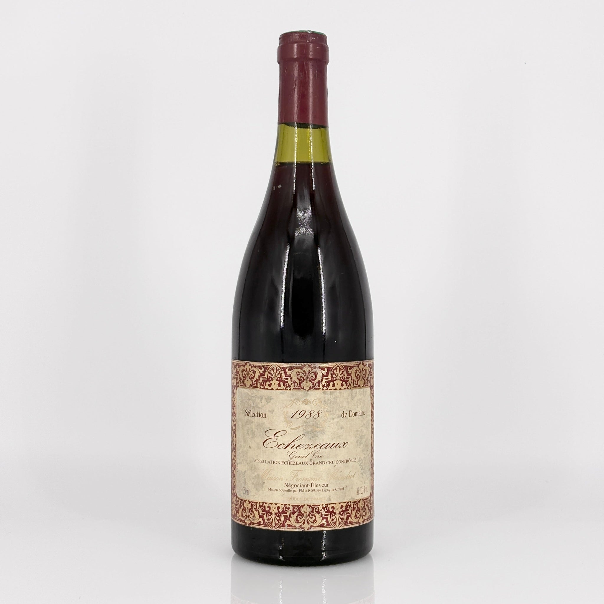 Wine bottle with decorative label on a white background