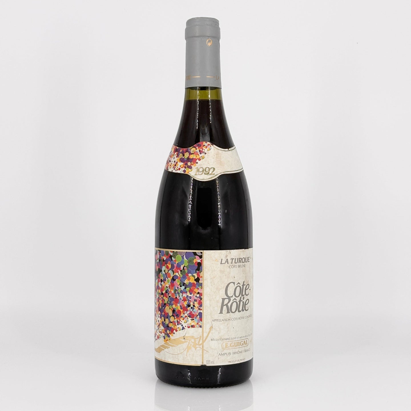 Wine bottle with colorful label on a white background