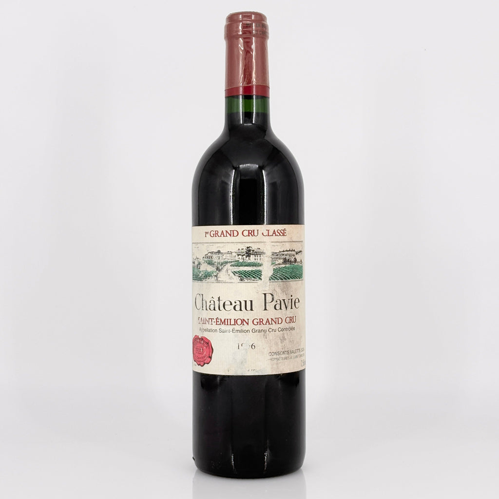 Red wine bottle with a visible label on a white background