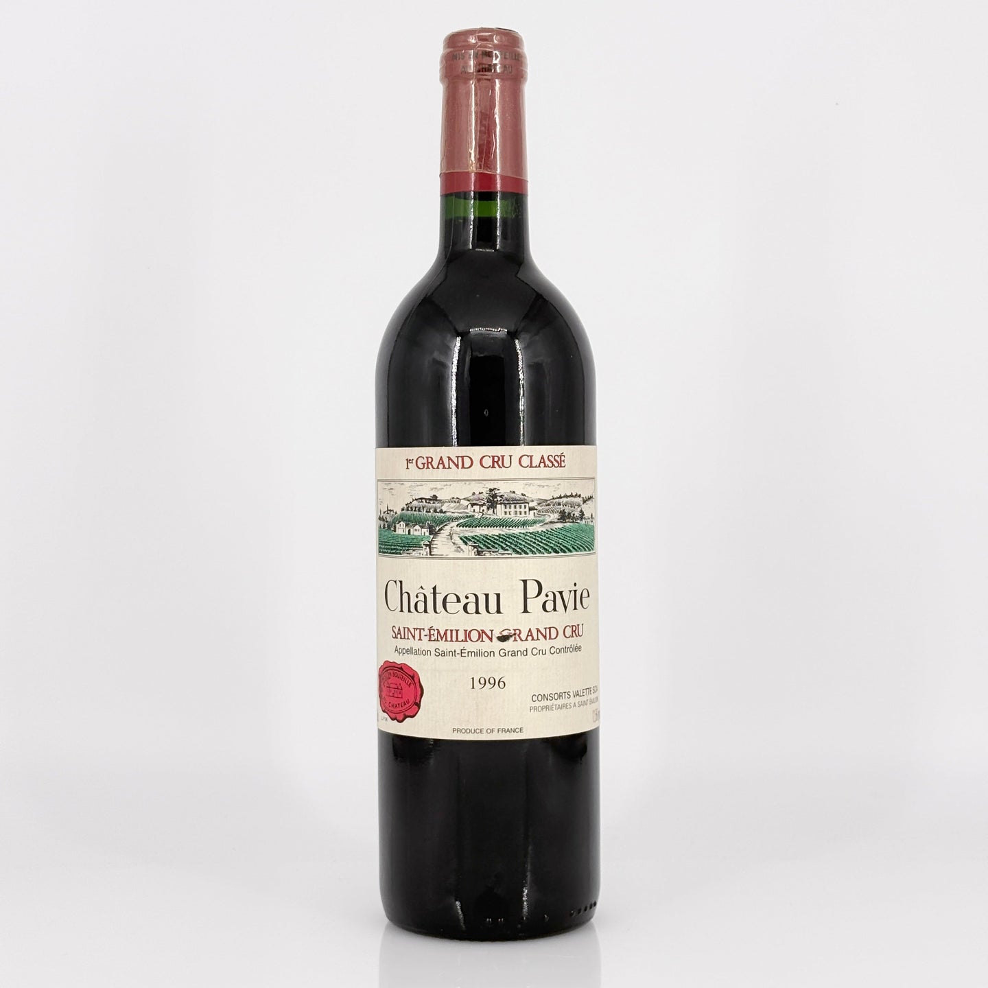 Bottle of Château Pavie red wine on a white background