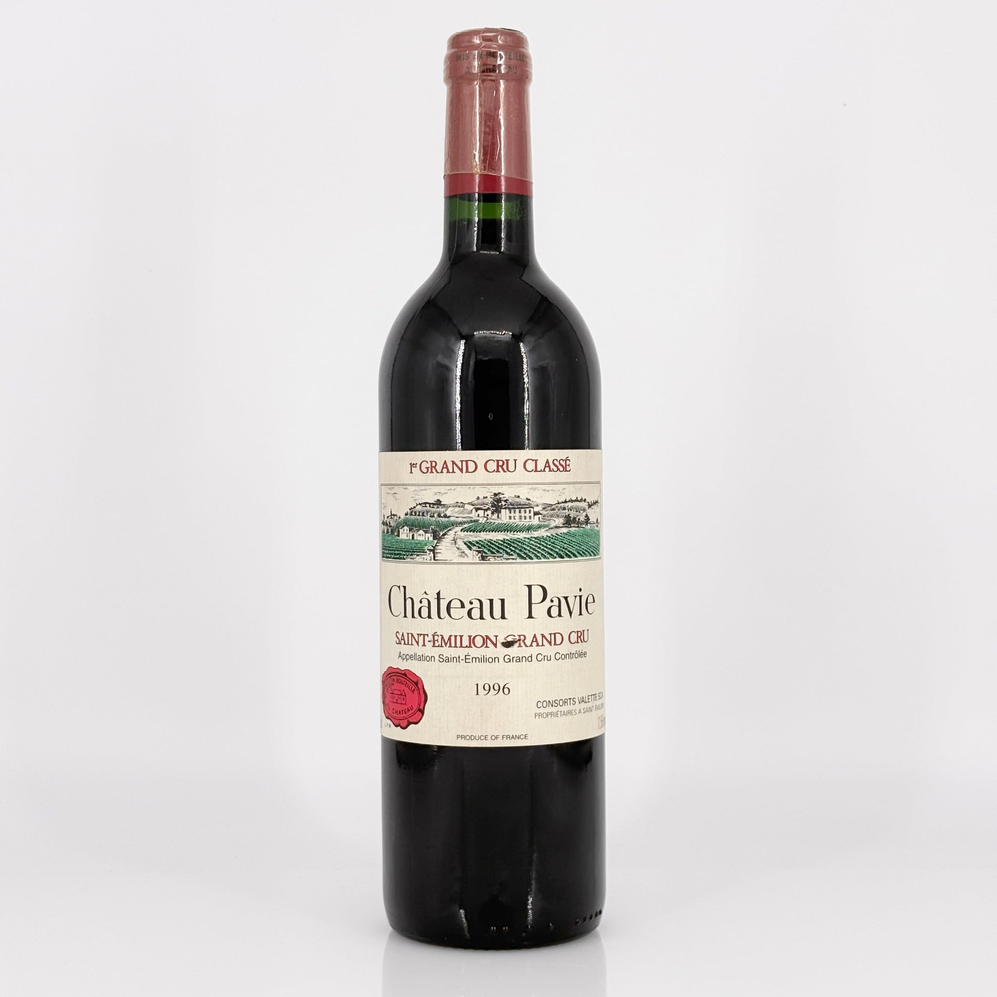 Bottle of Château Pavie red wine on a white background