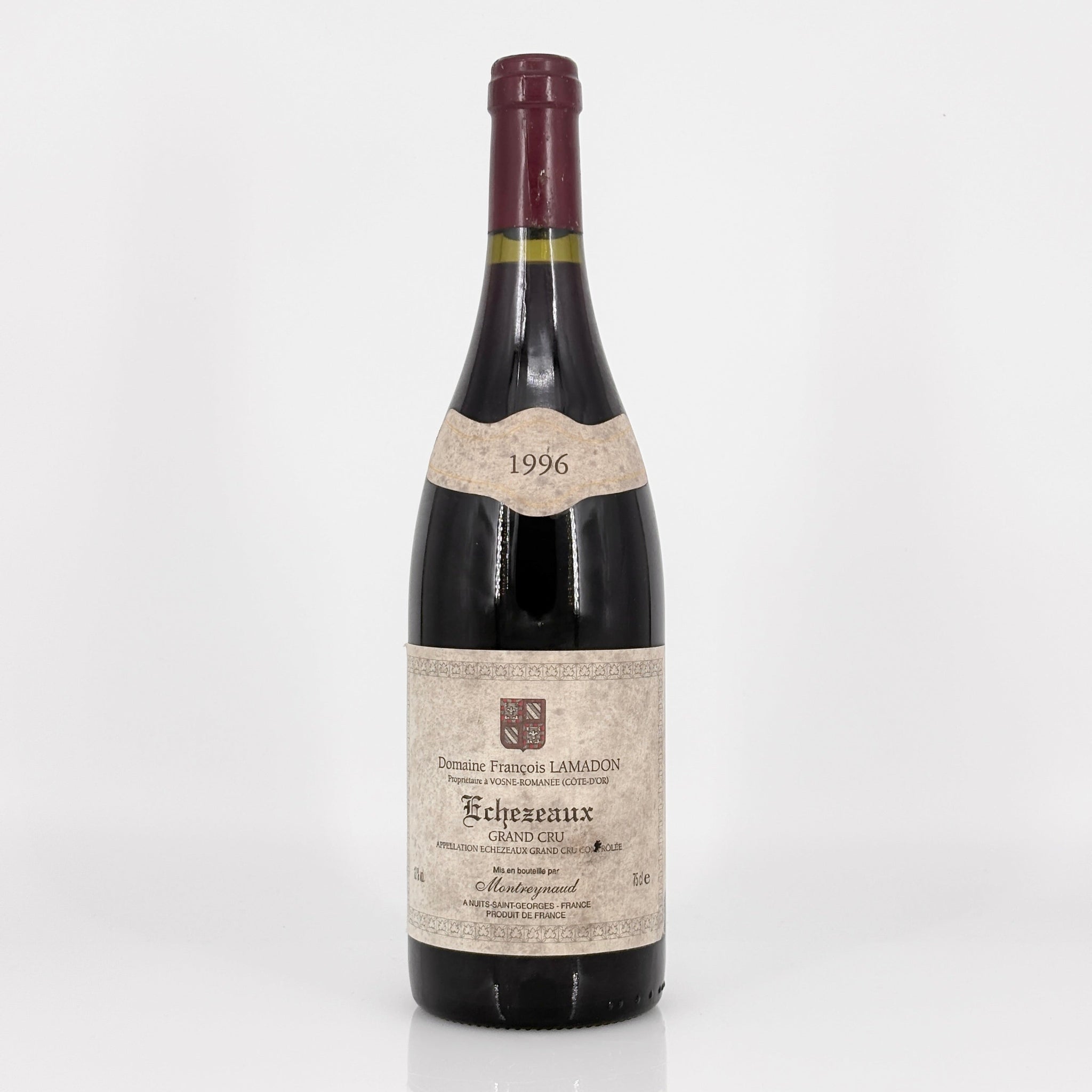 Bottle of 1996 Echezeaux Grand Cru wine on a white background