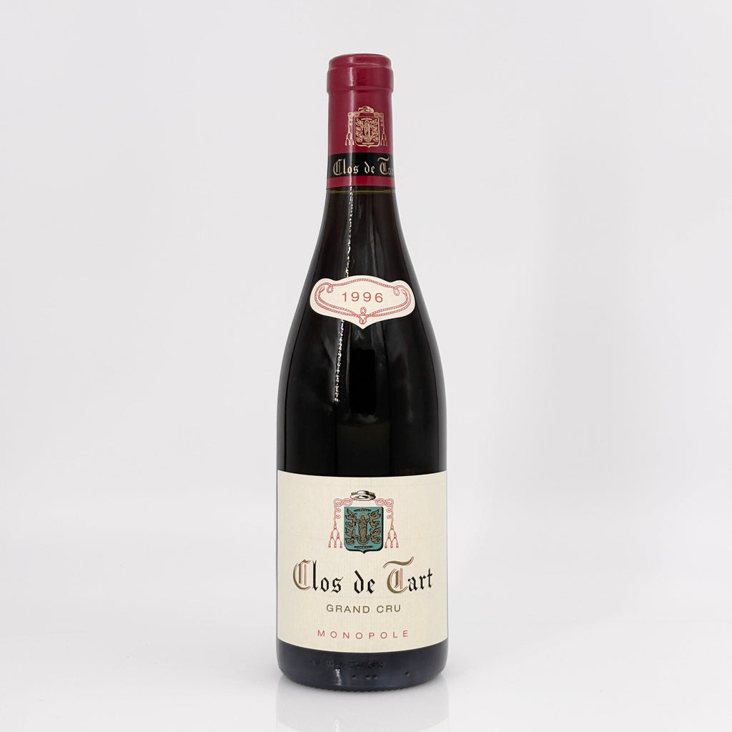 Bottle of Clos de Tart Grand Cru Monopole wine on a white background