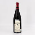 Bottle of Clos de Tart wine on a white background