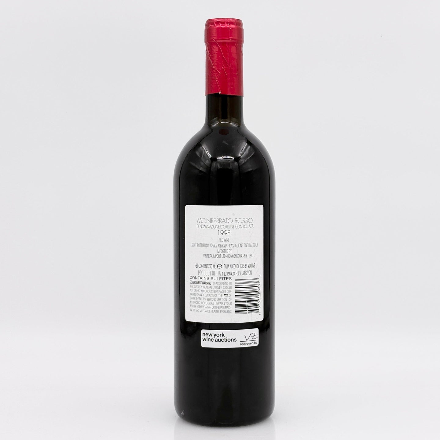 Red wine bottle with a visible label on a white background