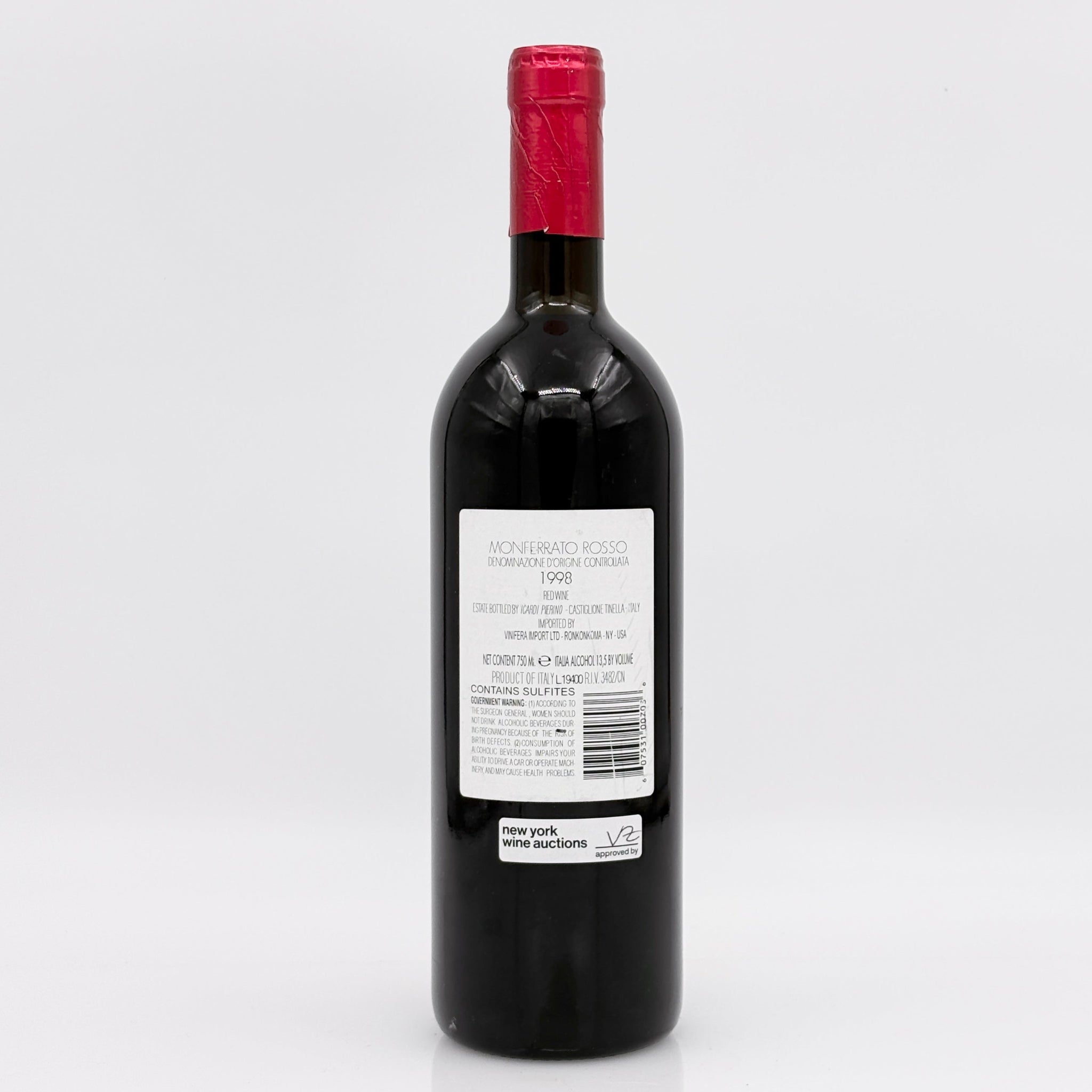 Red wine bottle with a visible label on a white background