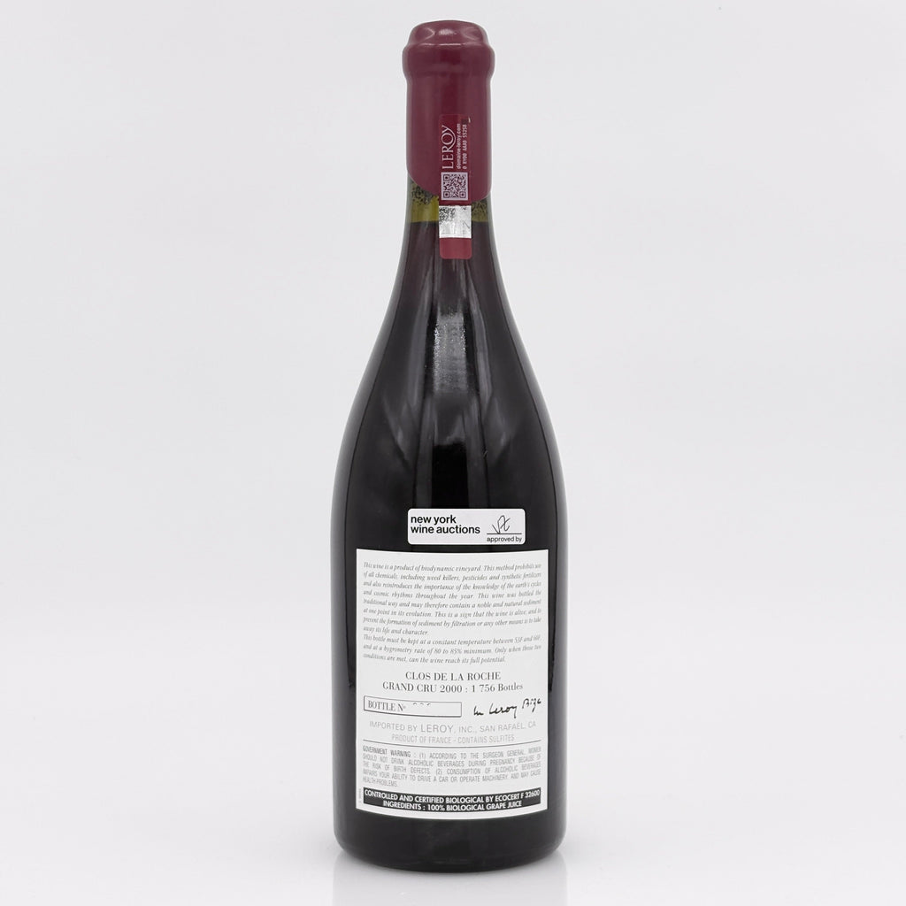 Red wine bottle with a visible label on a white background