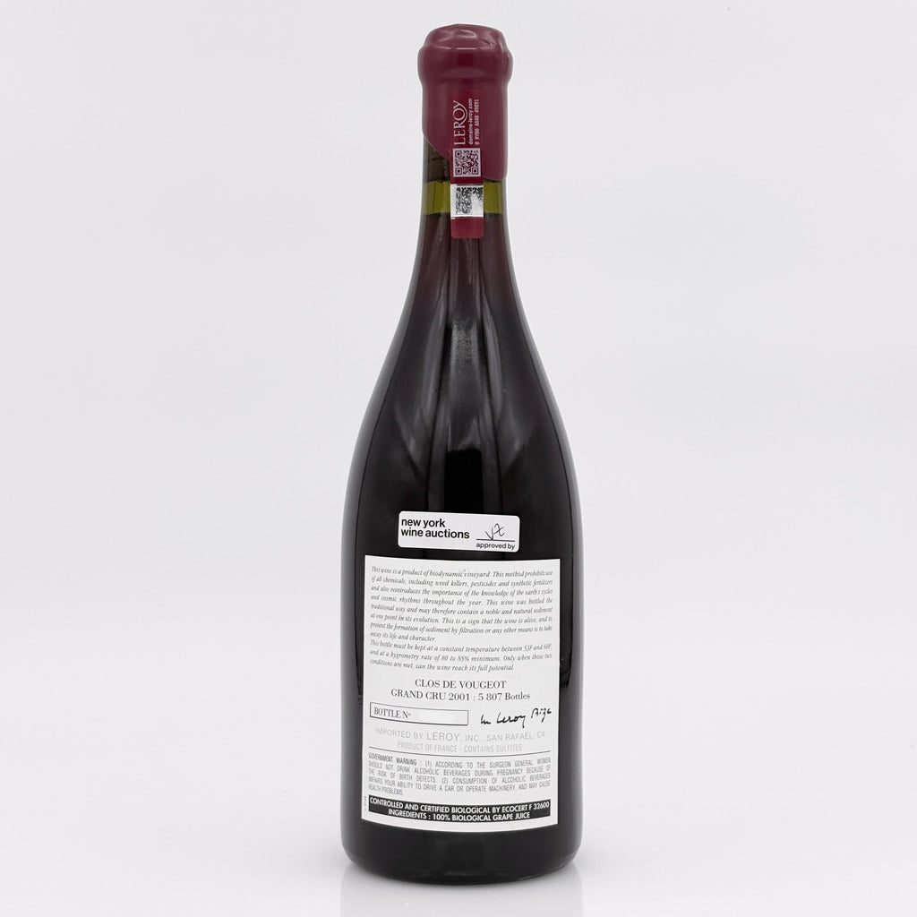 Red wine bottle with a visible label on a white background