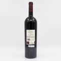 Red wine bottle with a visible label on a white background 