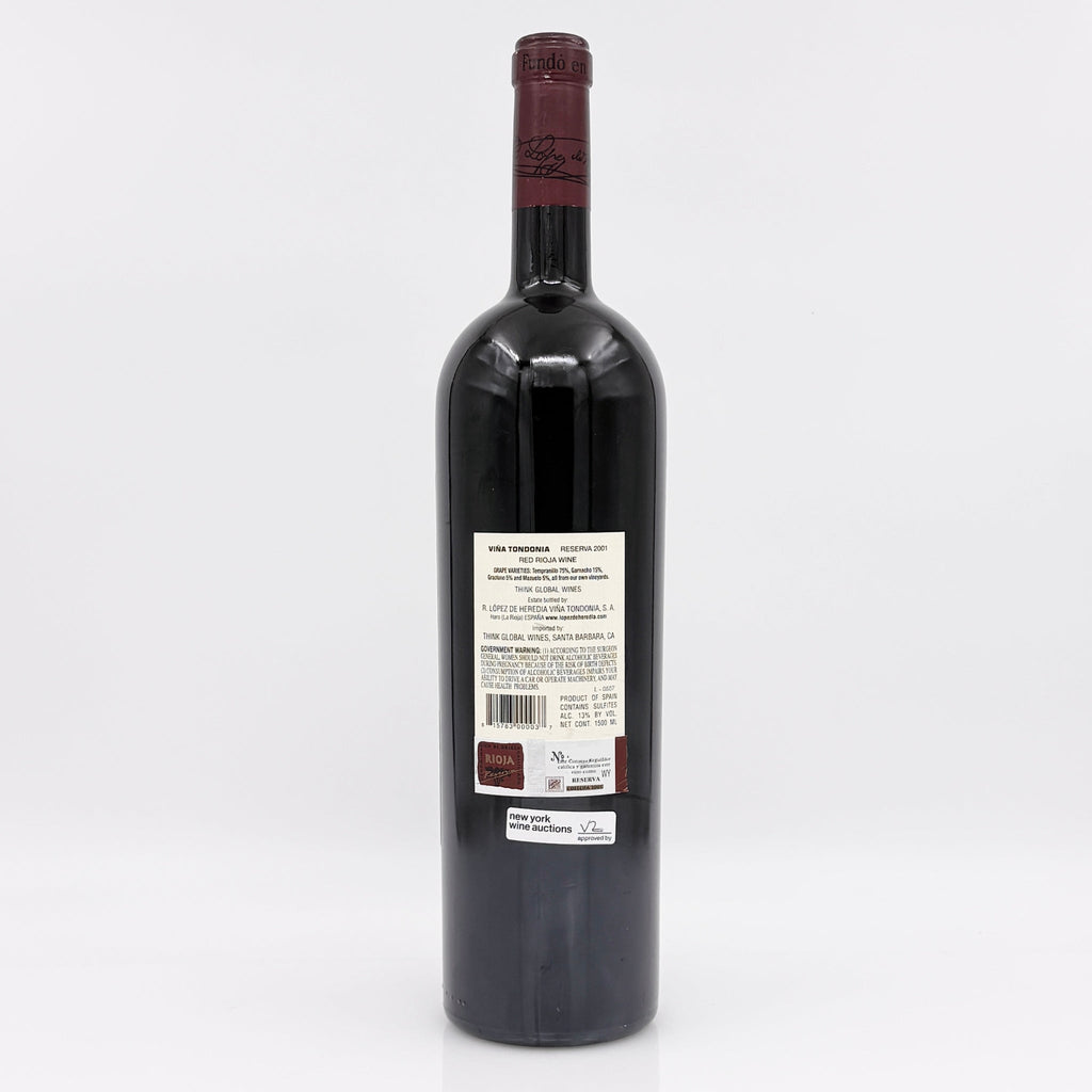 Red wine bottle with a visible label on a white background 