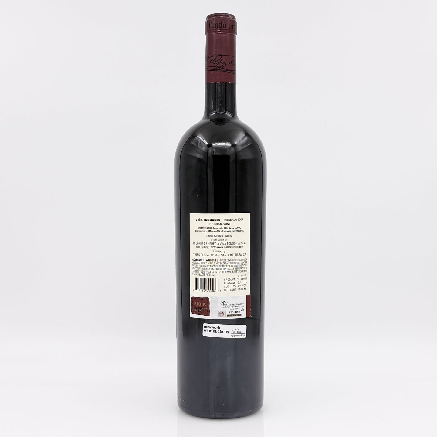 Red wine bottle with a visible label on a white background 