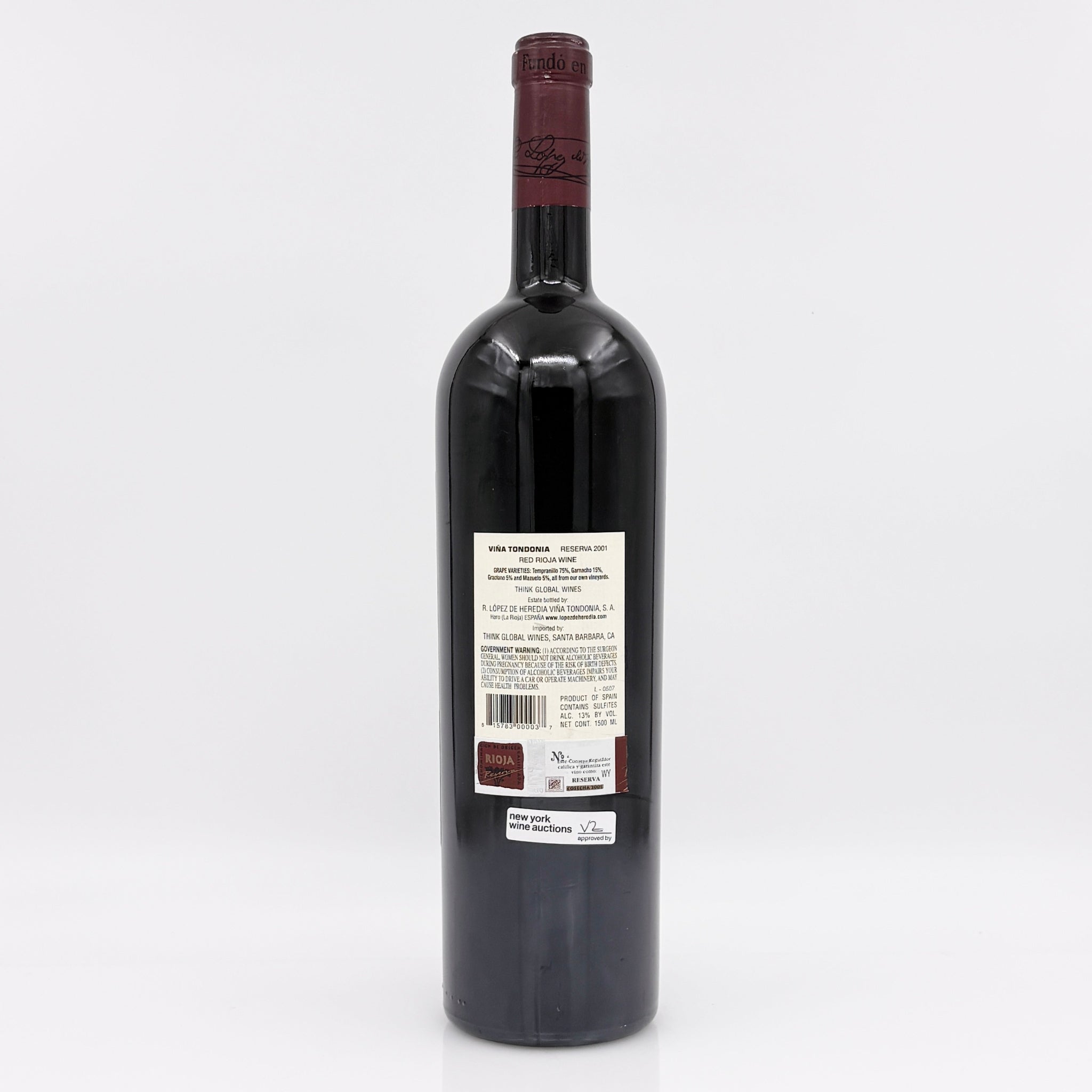 Red wine bottle with a visible label on a white background 