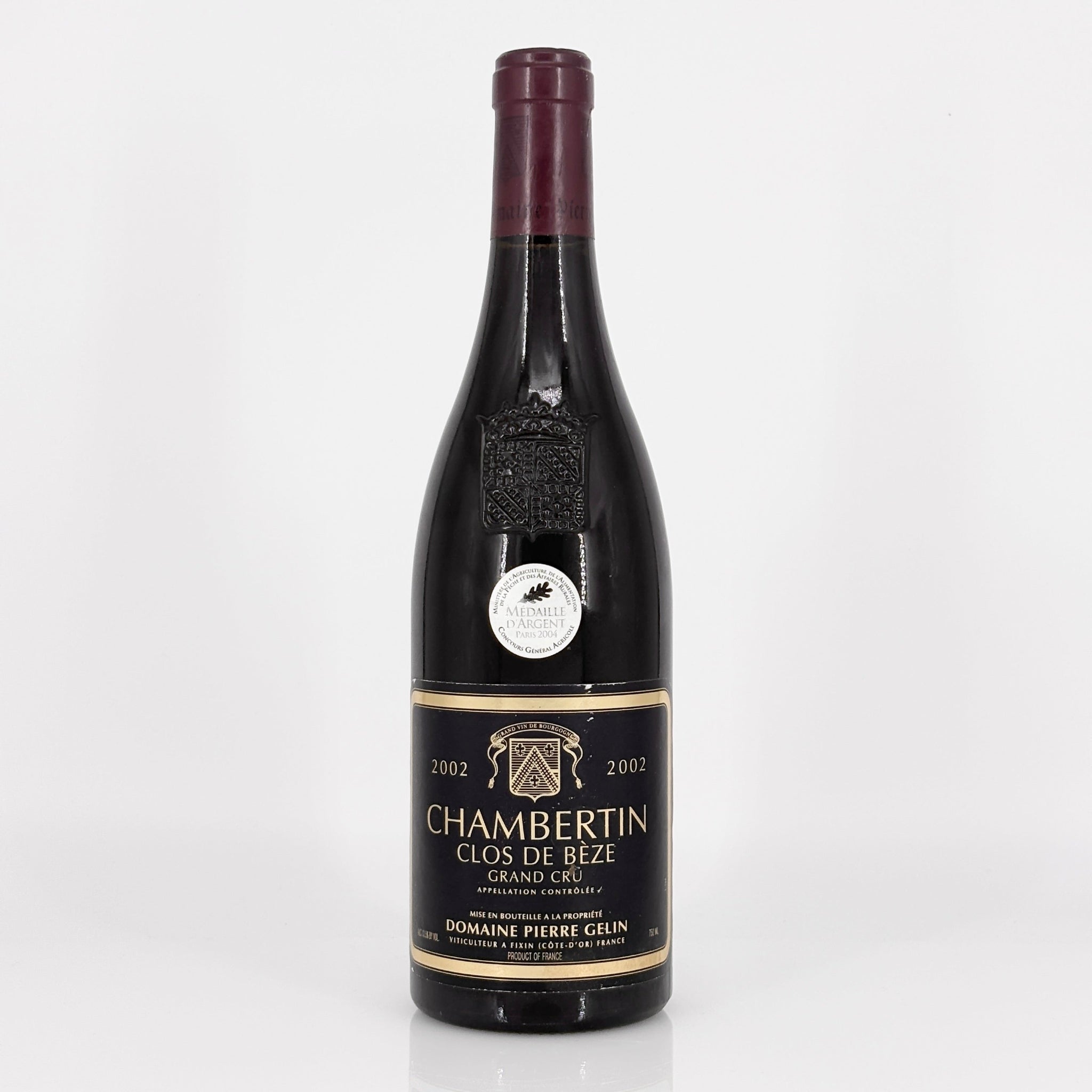 Wine bottle labeled 'Chambertin Clos de Beze Grand Cru' on a white background