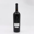 Black wine bottle with a label on a white background