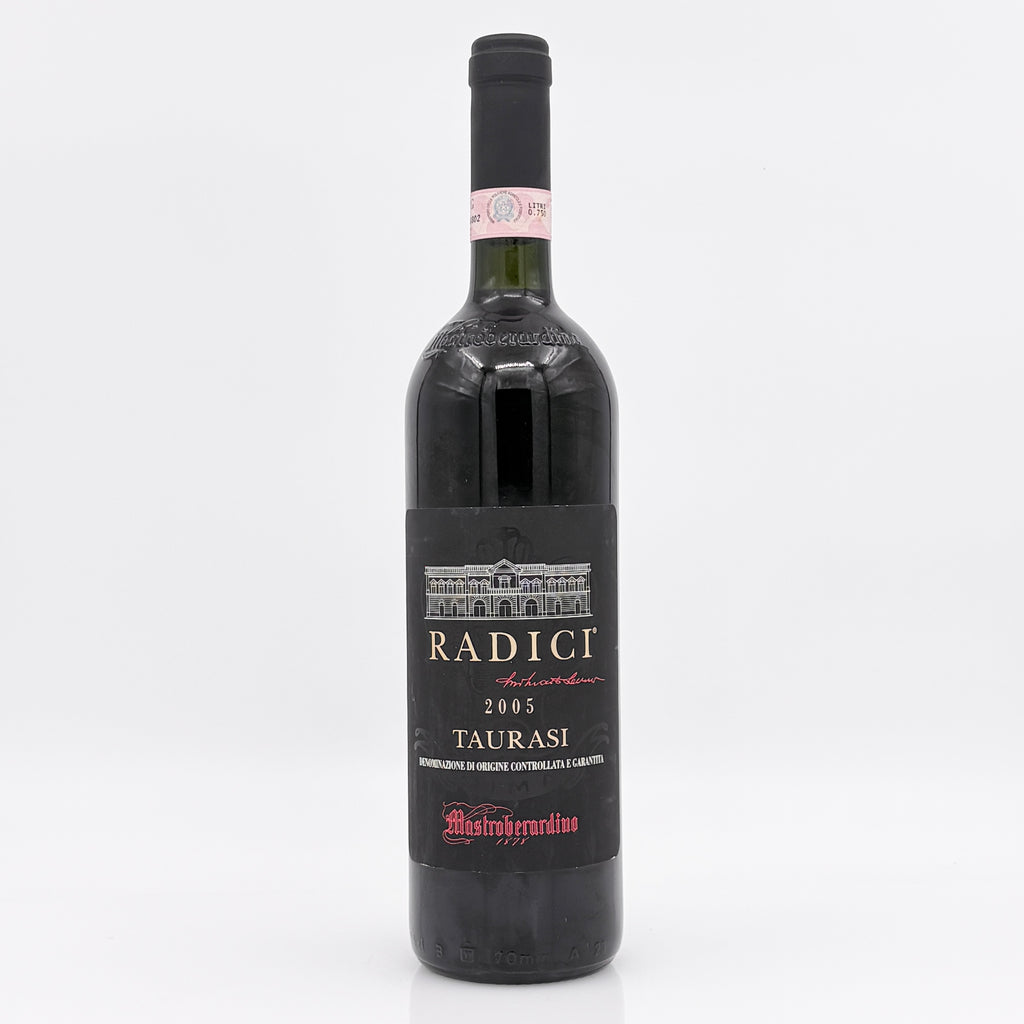 Red wine bottle with 'Radici' label on a white background