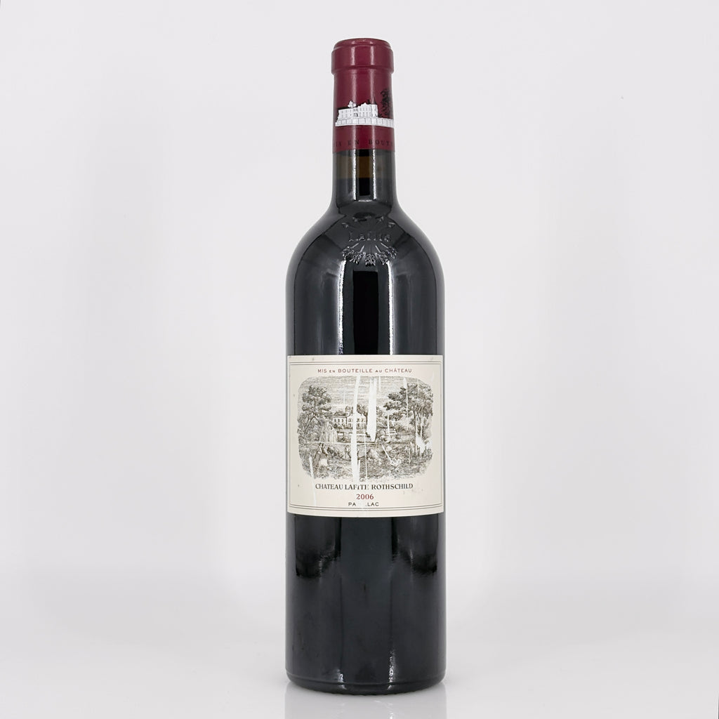 Red wine bottle with a label on a white background
