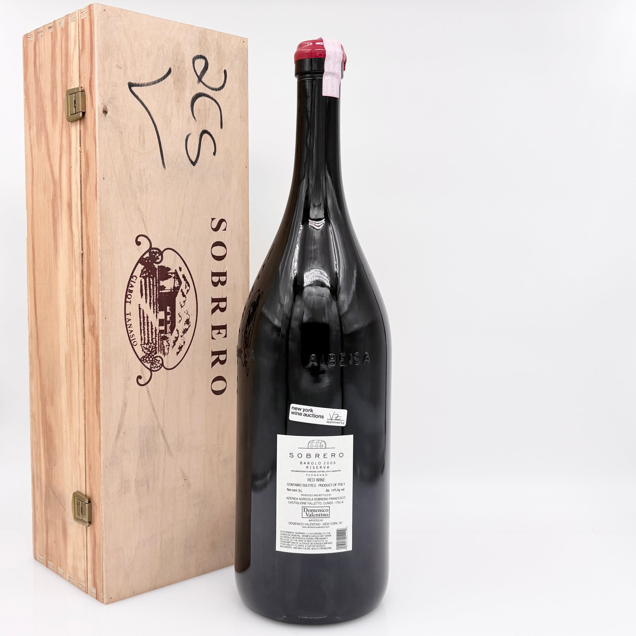 Large wine bottle with a wooden box labeled 'Sobrero' on a white background