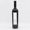 Wine bottle with a white label on a light gray background