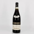 Wine bottle with 'Riserva' label on a white background