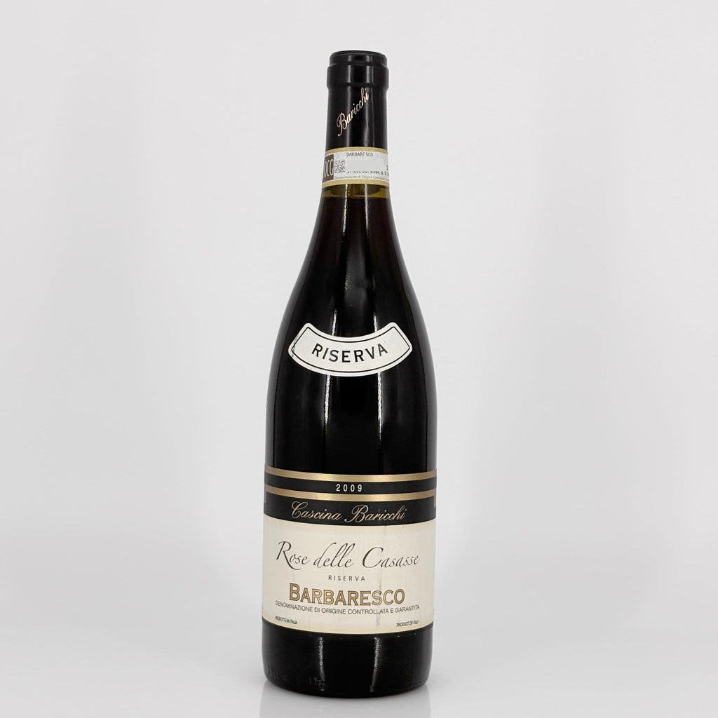 Wine bottle with 'Riserva' label on a white background