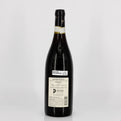 Wine bottle with a visible label on a white background