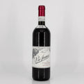 Red wine bottle with a visible label on a white background