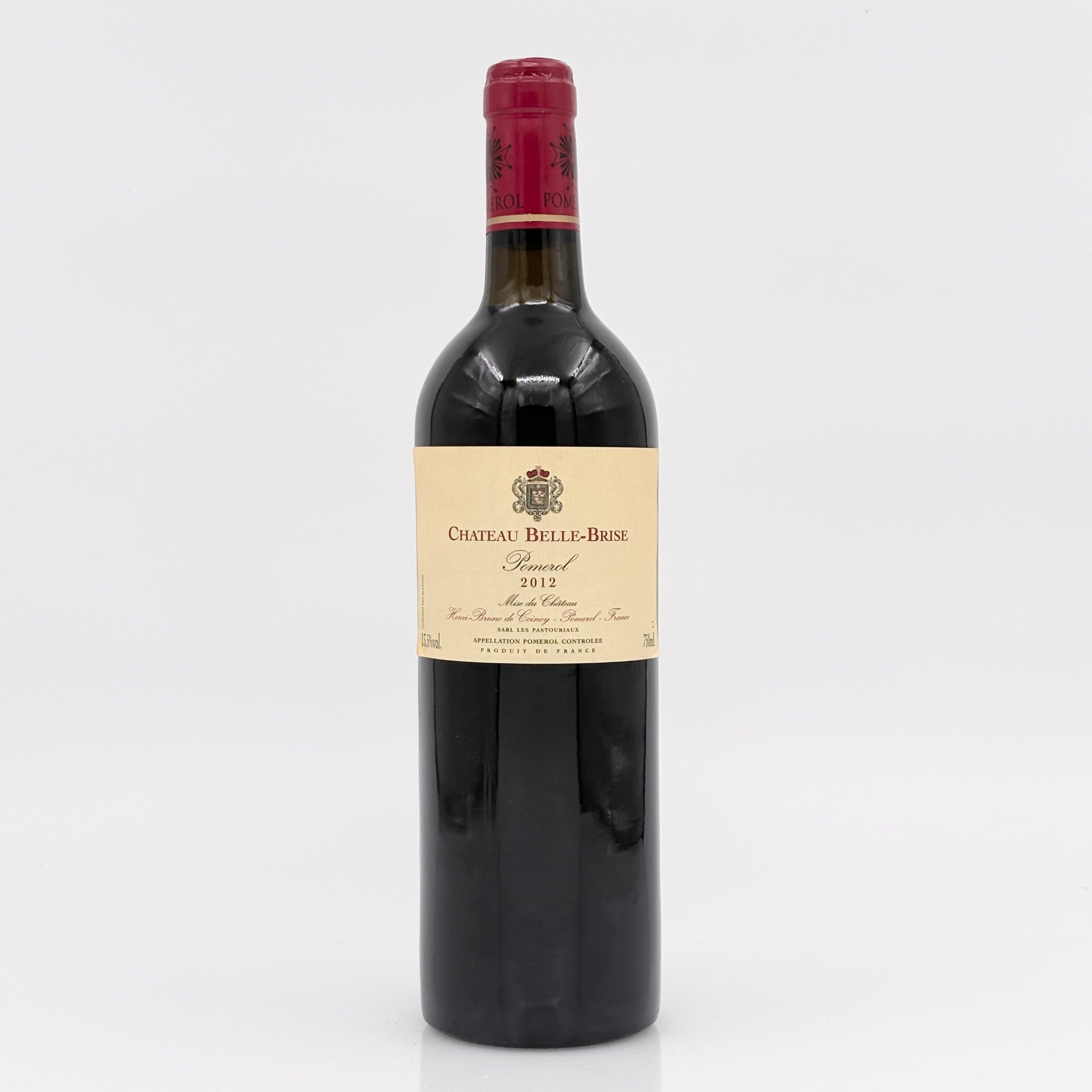 Red wine bottle with a visible label on a white background