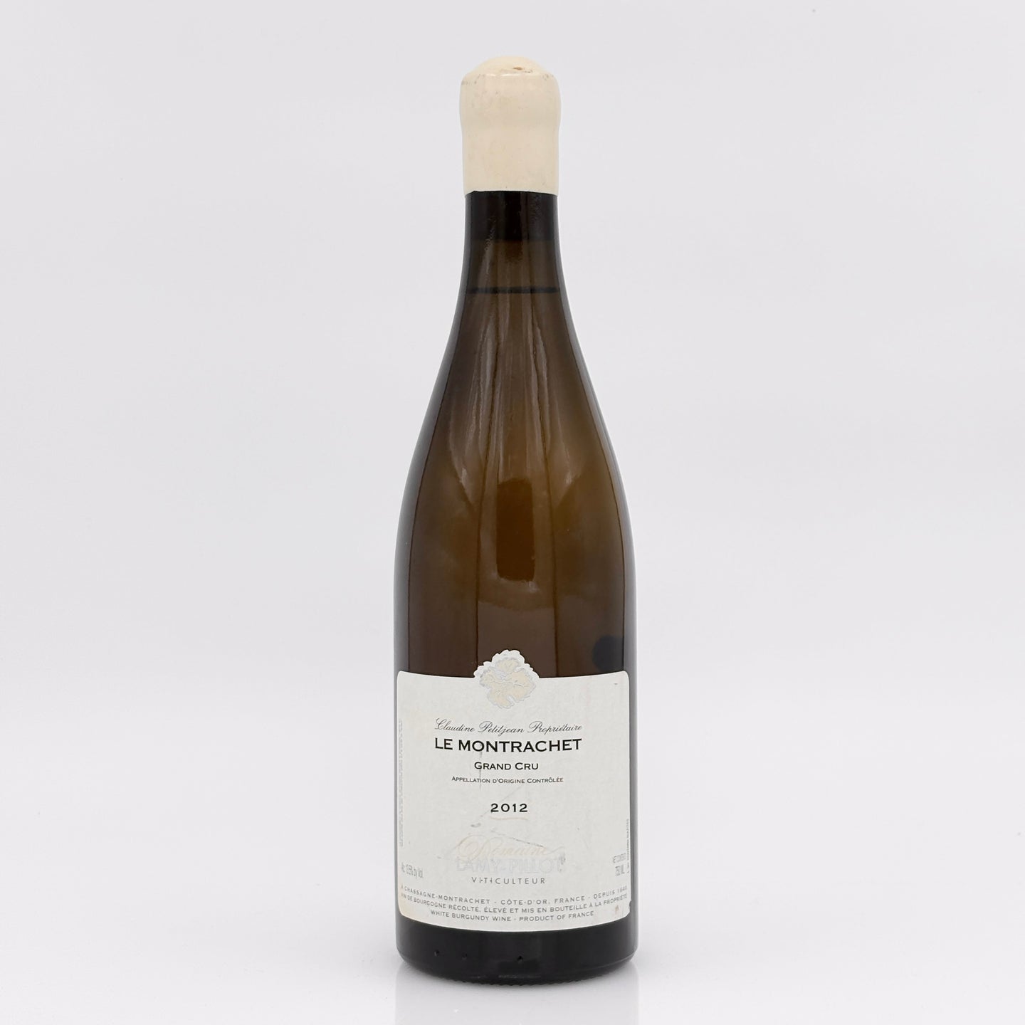 Wine bottle labeled 'Le Montrachet' on a white background