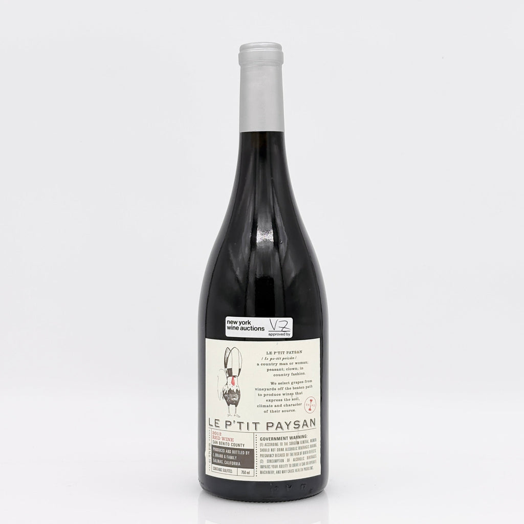 Wine bottle labeled 'Le Petit Paysan' on a white background 