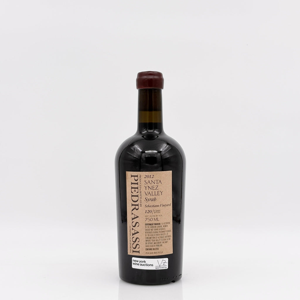 Wine bottle of syrah with a white background. 