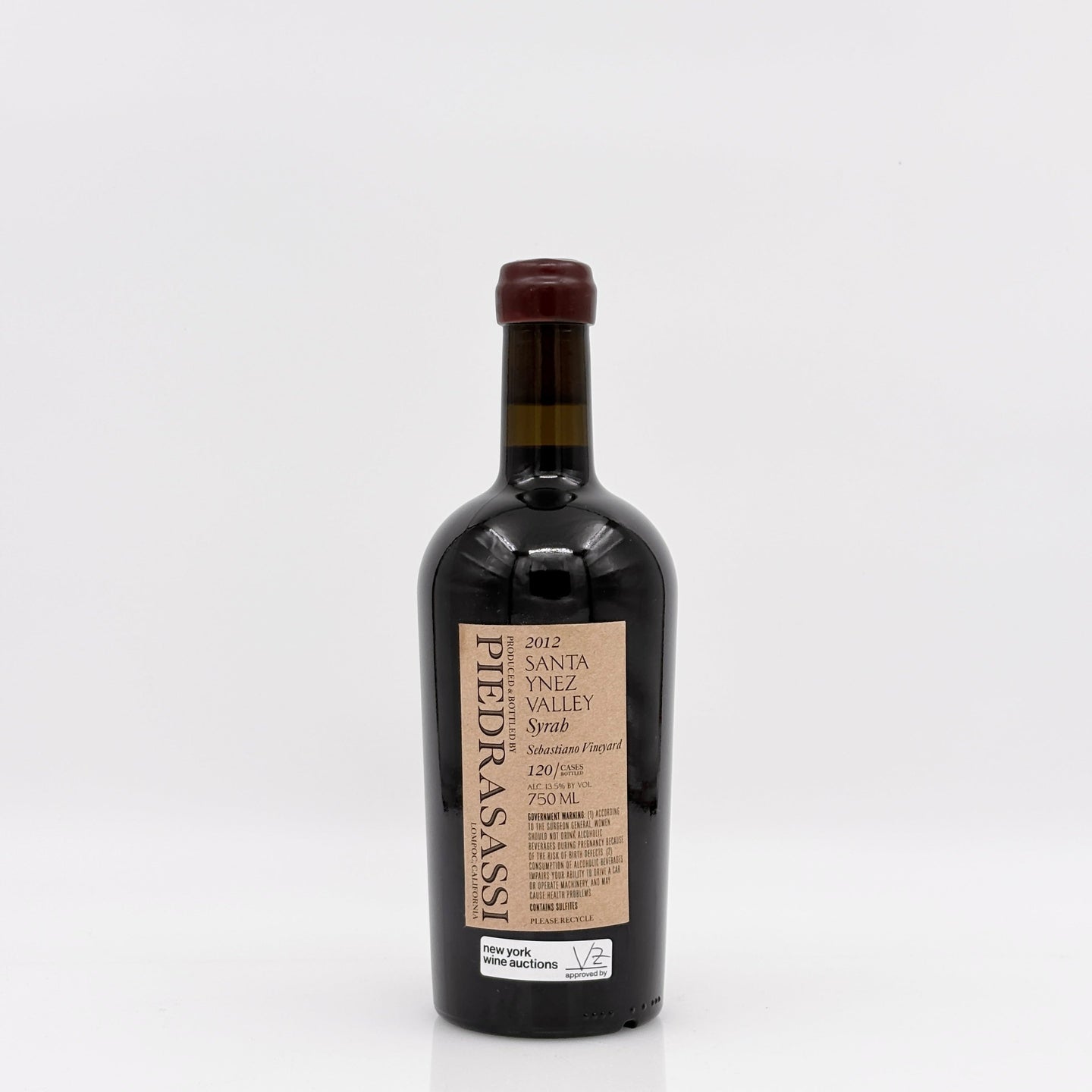 Wine bottle of syrah with a white background. 