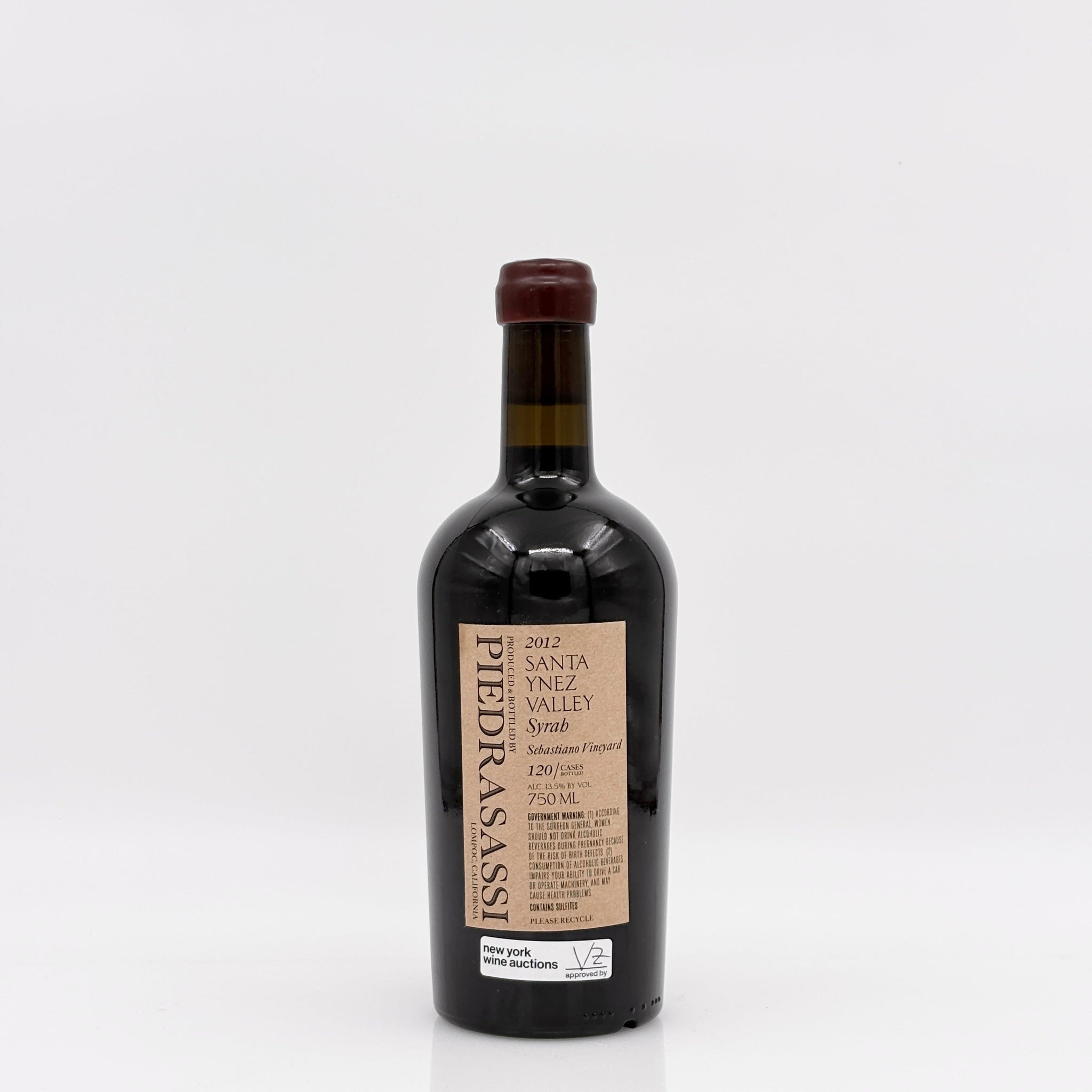Wine bottle of syrah with a white background. 