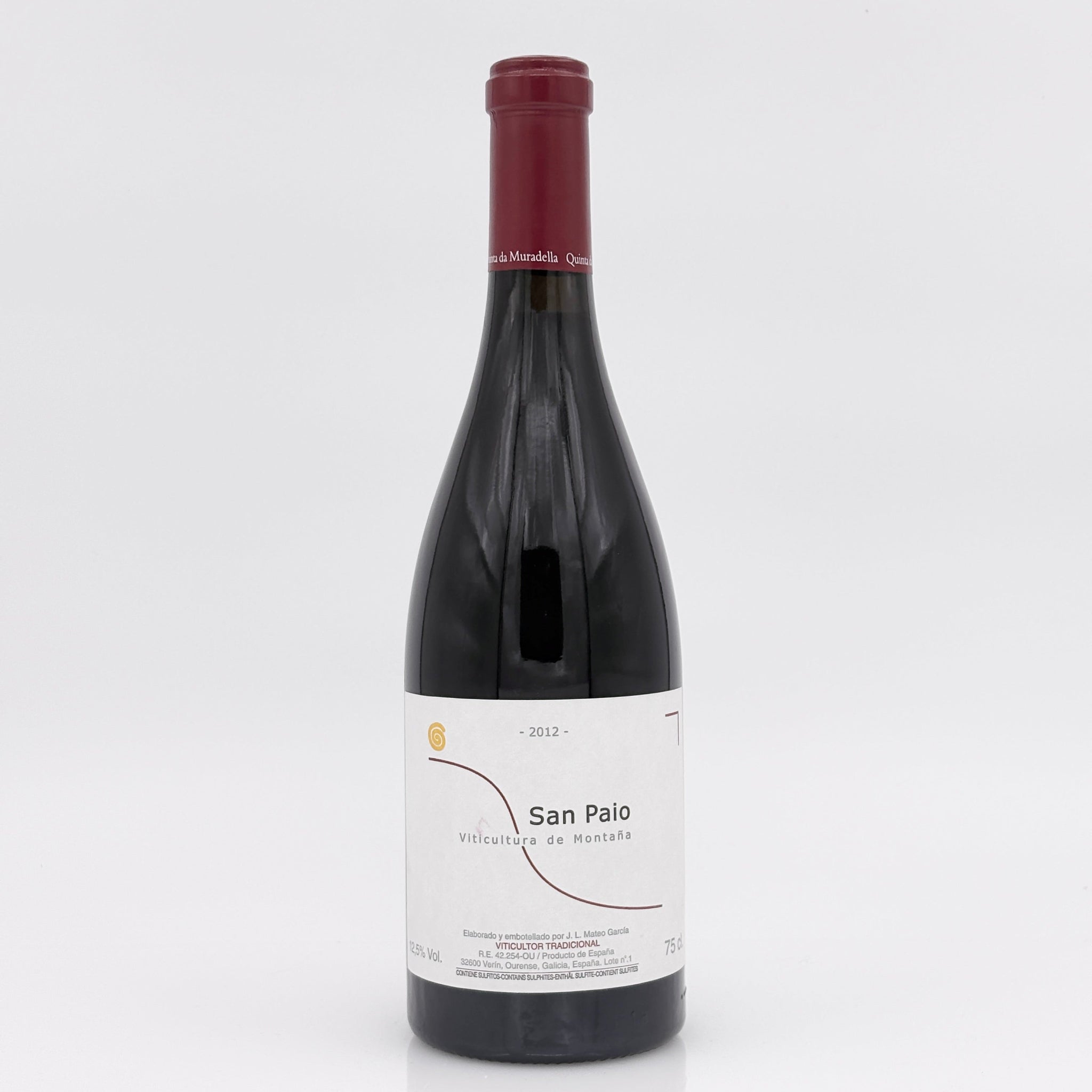 Red wine bottle with a white label on a light gray background